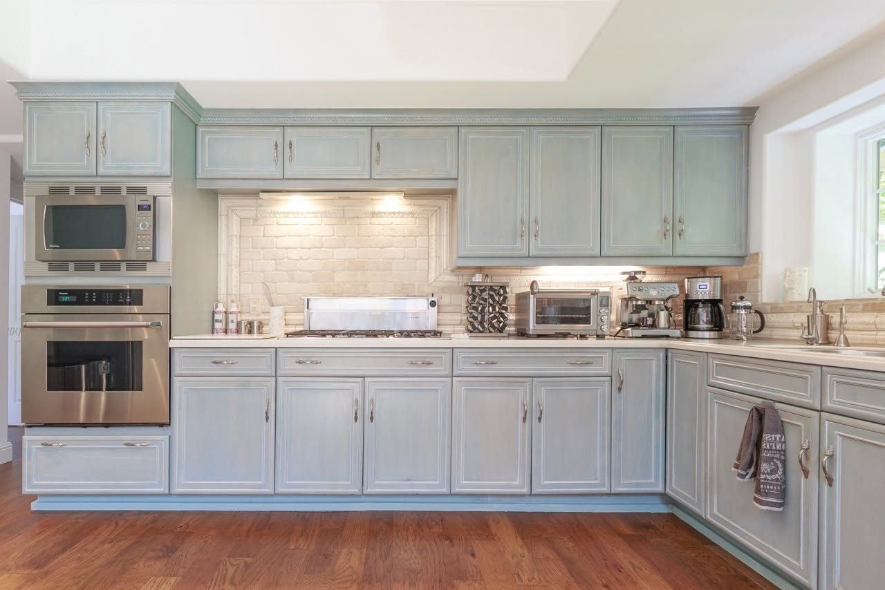 Healdsburg kitchen remodel with pale cabinetry and wood flooring