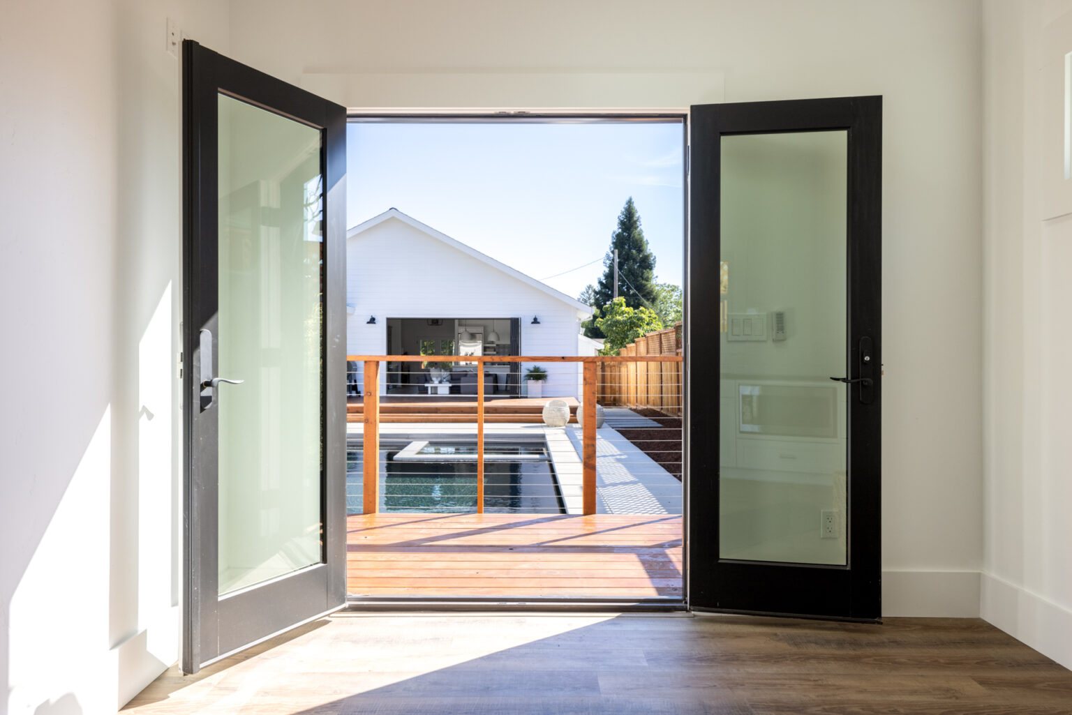 View through open doors toward the backyard